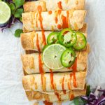 Stack of baked chicken taquitos