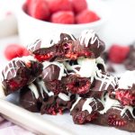 Pieces of chocolate raspberry bark stacked on top of each other.
