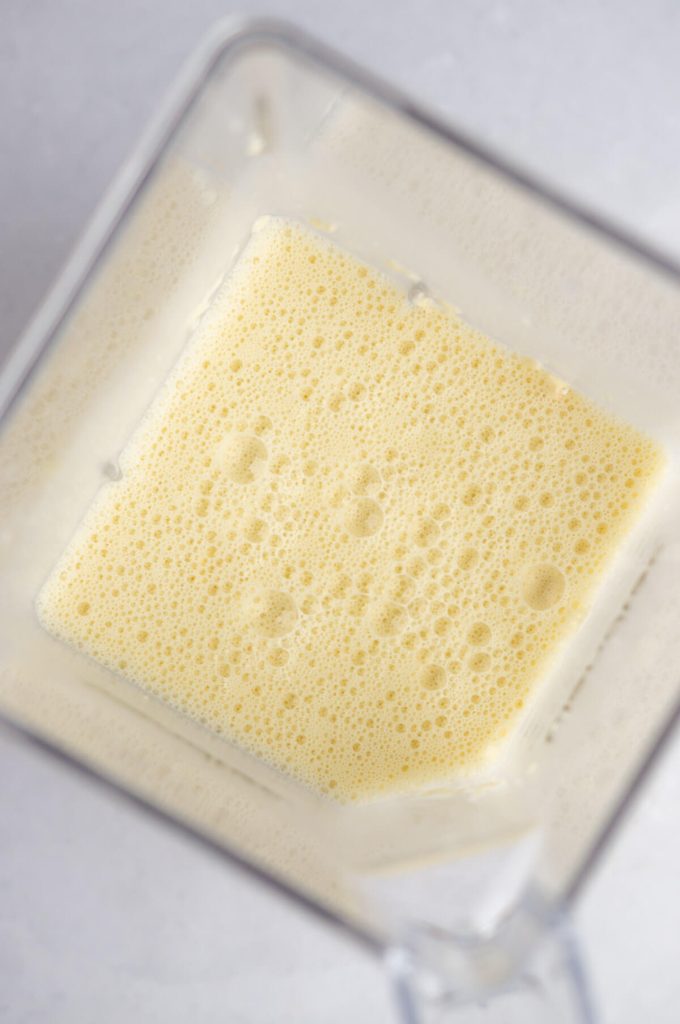 Overhead photo of almond milk crepes ingredients in a blender.