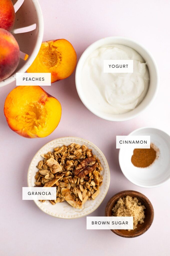 Photo of peaches, greek yogurt, granola, cinnamon, and brown sugar.