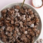 Overhead photo of vegan puppy chow with a gold spoon.