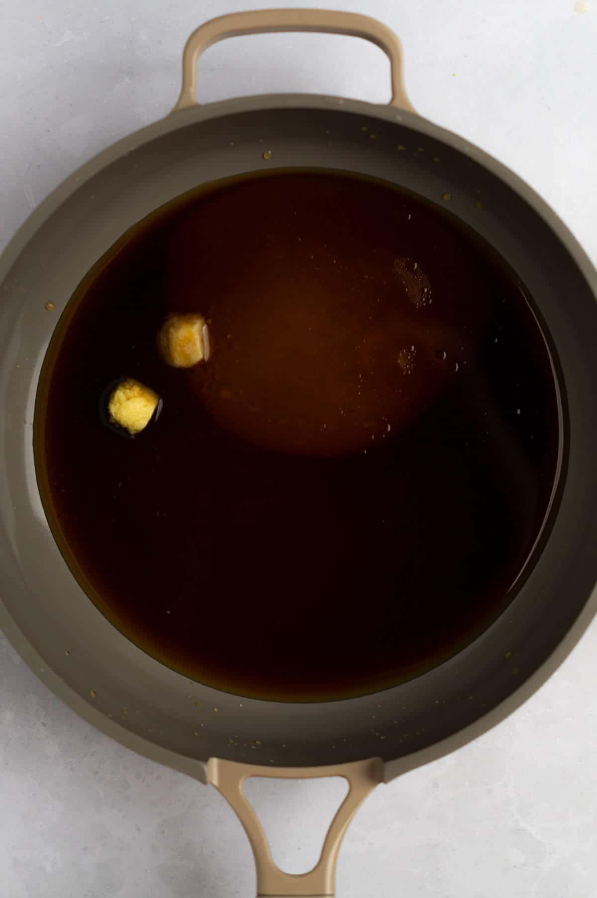 An overhead shot of a saucepan of homemade teriyaki sauce.
