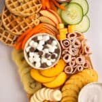 Kid-friendly foods arranged on a charcuterie board.