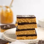 Stack of no bake chocolate peanut butter oat bars.
