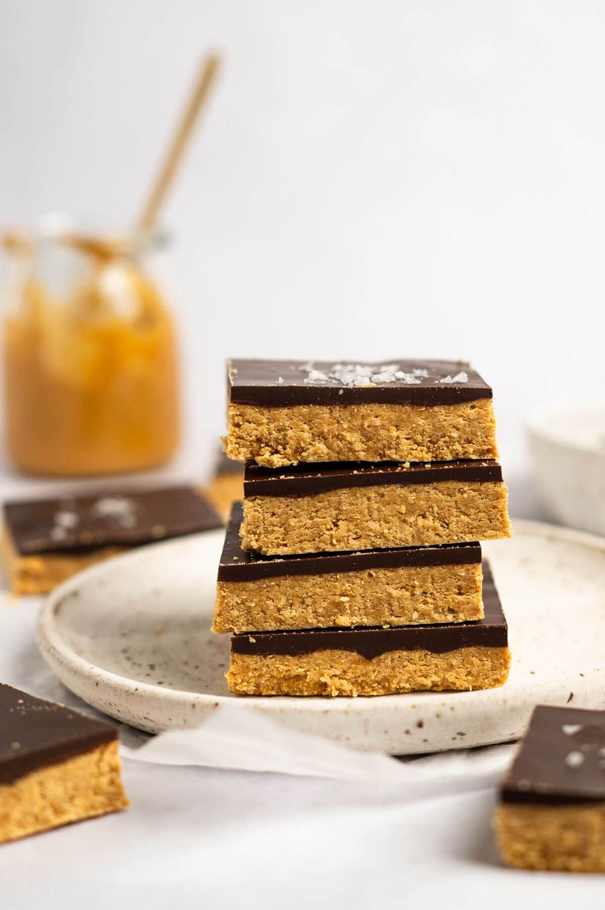 Stack of no bake chocolate peanut butter oat bars.