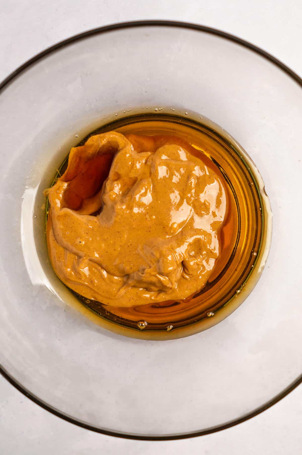 Bowl of maple syrup and peanut butter.