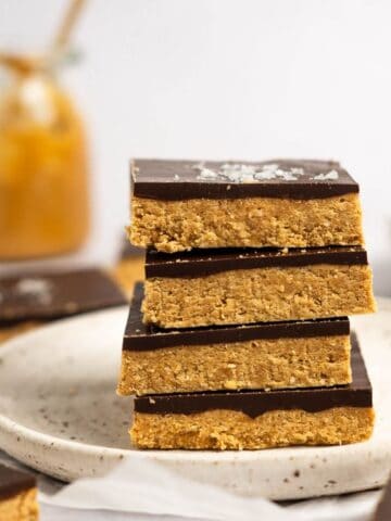Stack of no bake chocolate peanut butter oat bars.