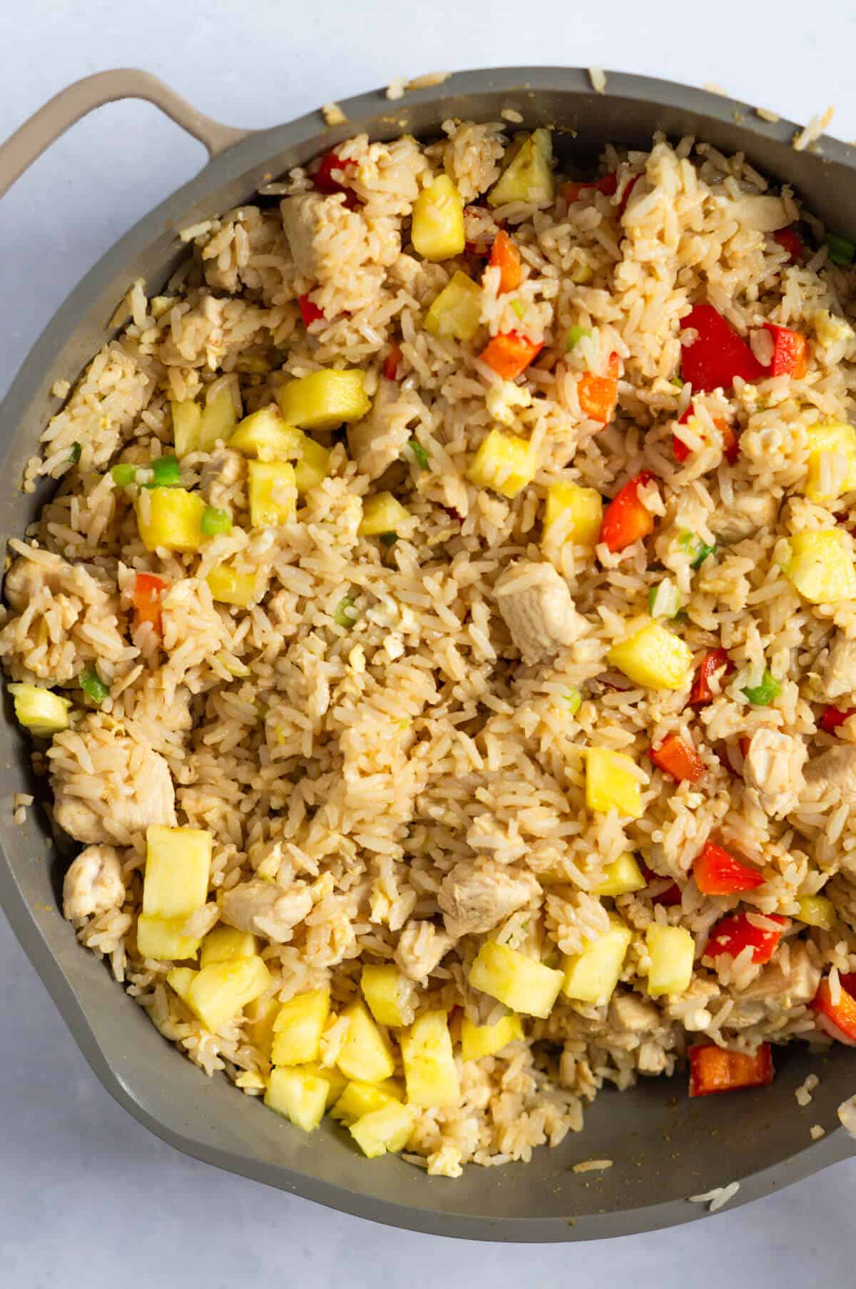 Pineapple fried rice in a pan.