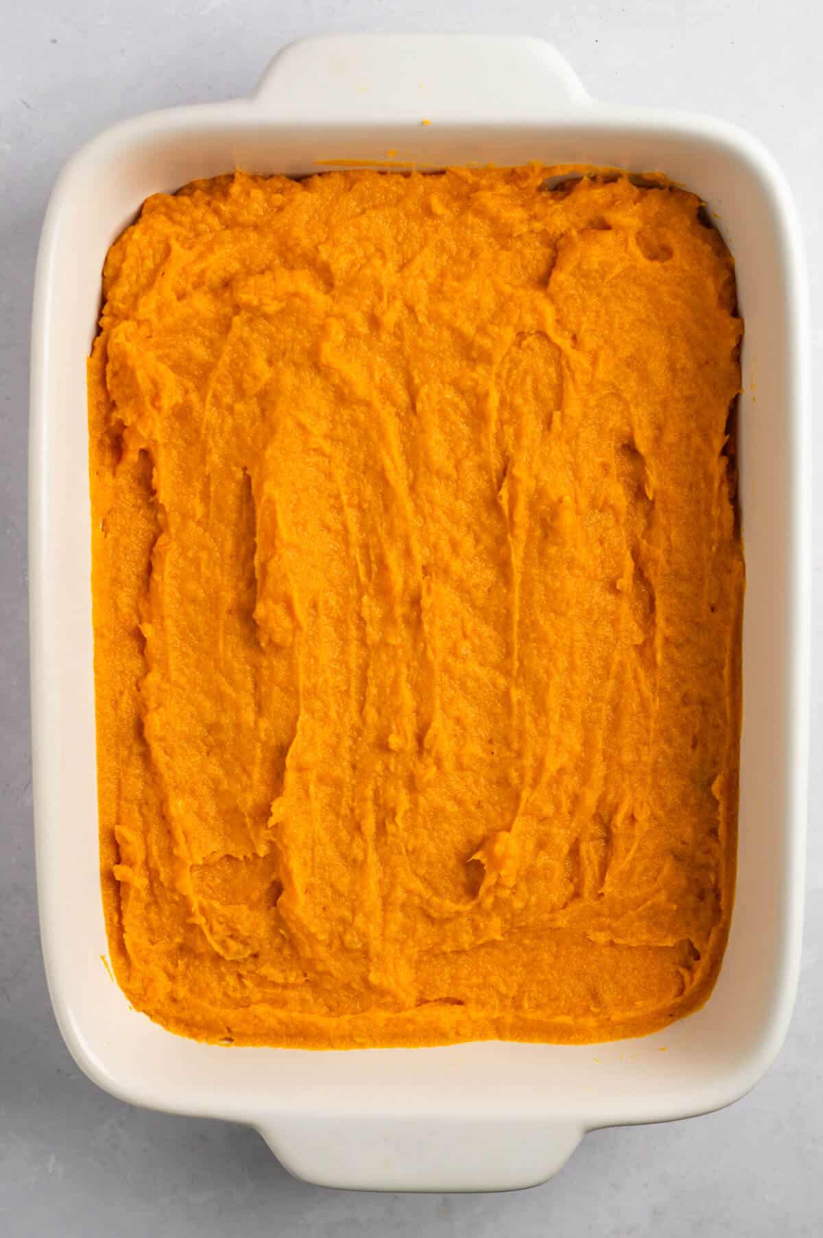 The sweet potato casserole mixture in a baking dish.