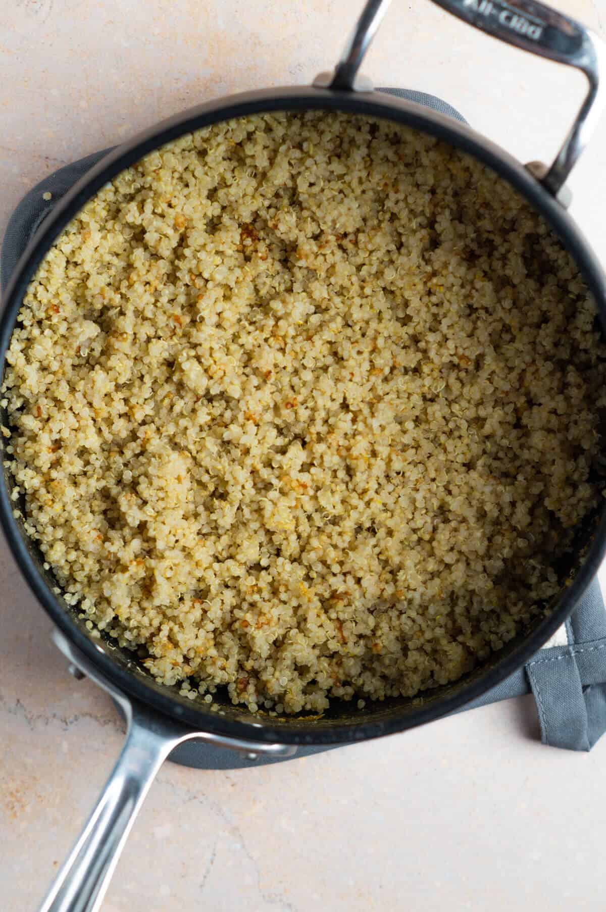 A pot with cooked quinoa.