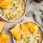 Overhead shot of two bowls of deconstructed chicken pot pie.