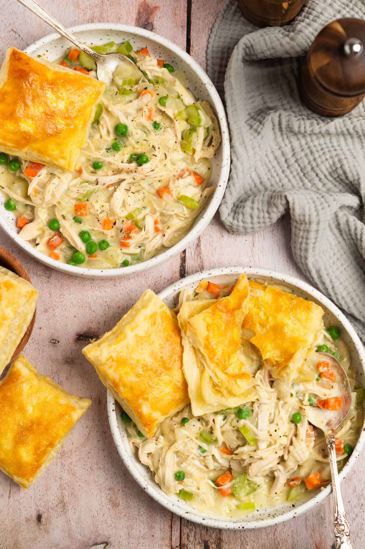 Overhead shot of two bowls of deconstructed chicken pot pie.