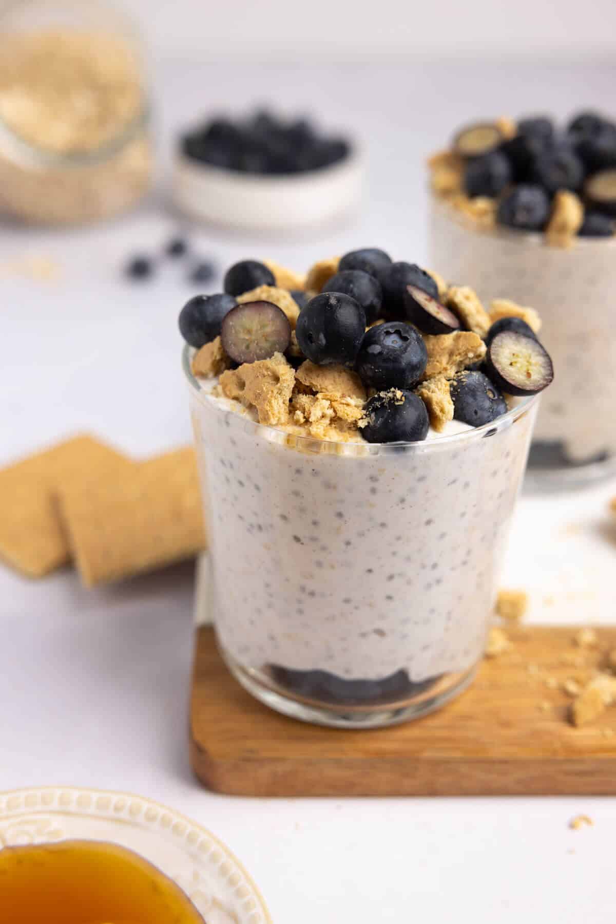 A cup with blueberry cheesecake overnight oats.