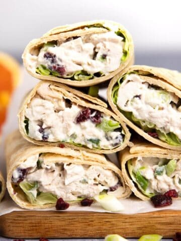 An up close shot of chicken salad wraps cut open to show the chicken salad.