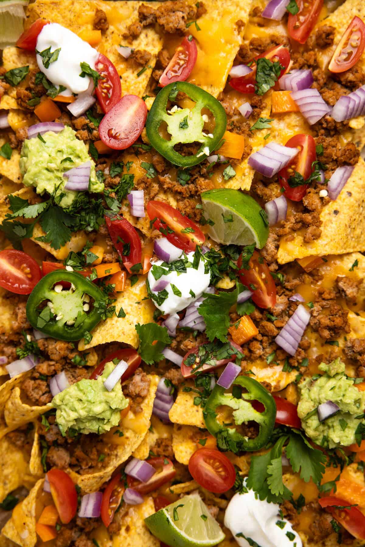 A close up shot of the loaded ground turkey nachos.