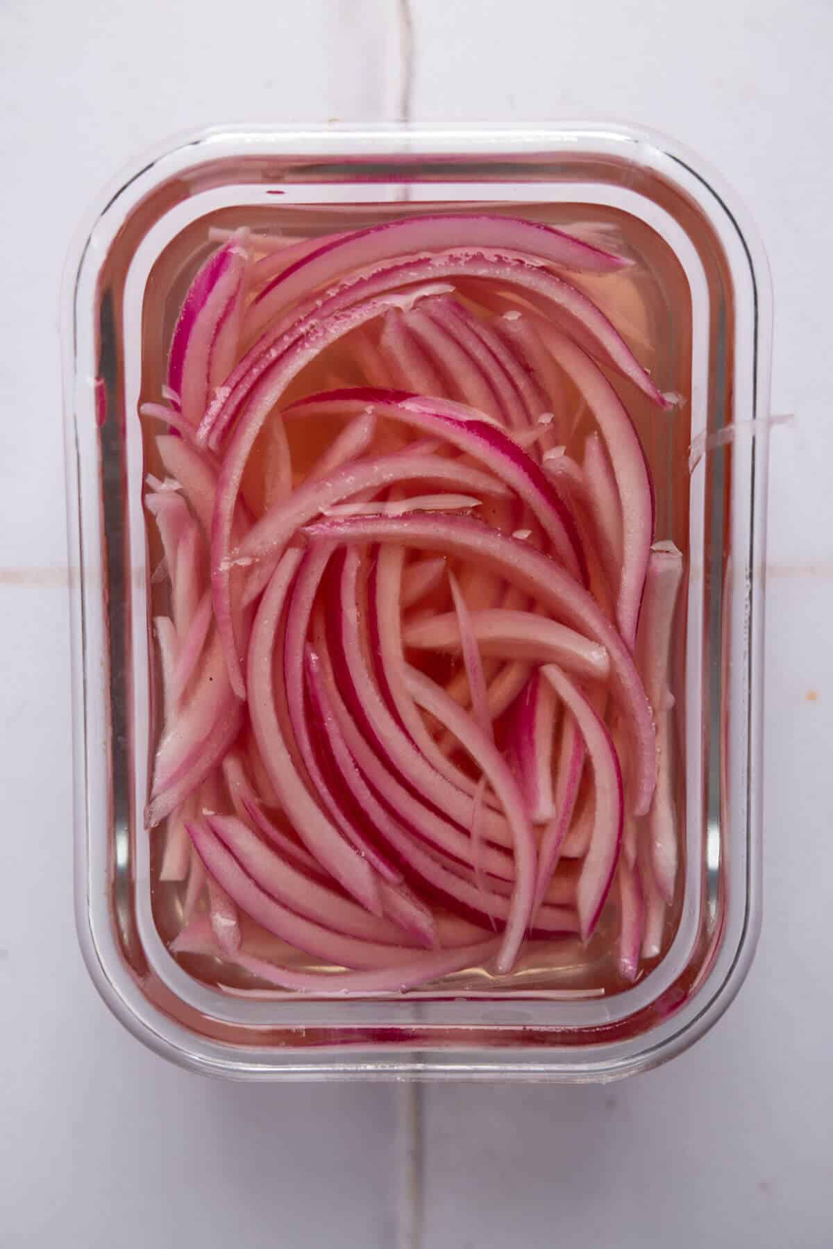 Pickled red onions in a bowl.