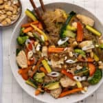 A large bowl of glass noodles stir fry.