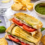 A side shot of a cut pesto turkey panini.