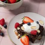 Chocolate baked oats with yogurt and berries on top.