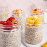 Forward facing shot of four mason jars of overnight oats.