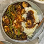A serving of the cast iron chicken skillet over mashed potatoes.