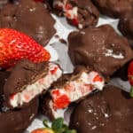 A close up picture of a group of chocolate covered strawberry yogurt clusters.