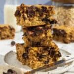 Small plate with a stack of three banana peanut butter bars.