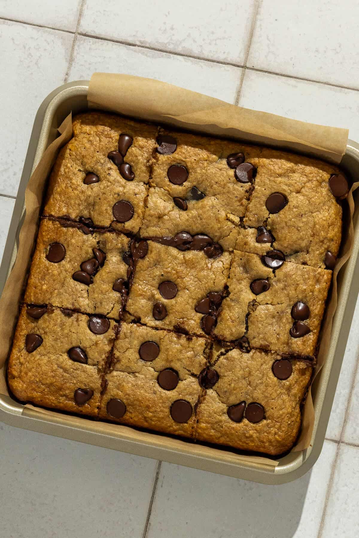 Baked banana peanut butter bars cut into 9 squares.