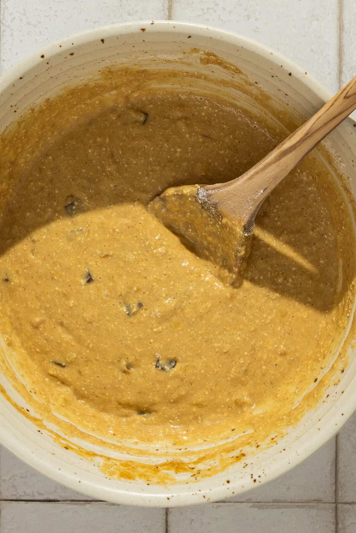 Batter for banana peanut butter bars with chocolate chips mixed in.