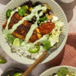 Two plated fish taco bowls.