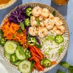 Plated spring roll in a bowl.
