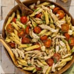A large serving bowl of balsamic chicken pasta salad.
