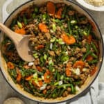 A skillet with ground turkey green bean stir fry.