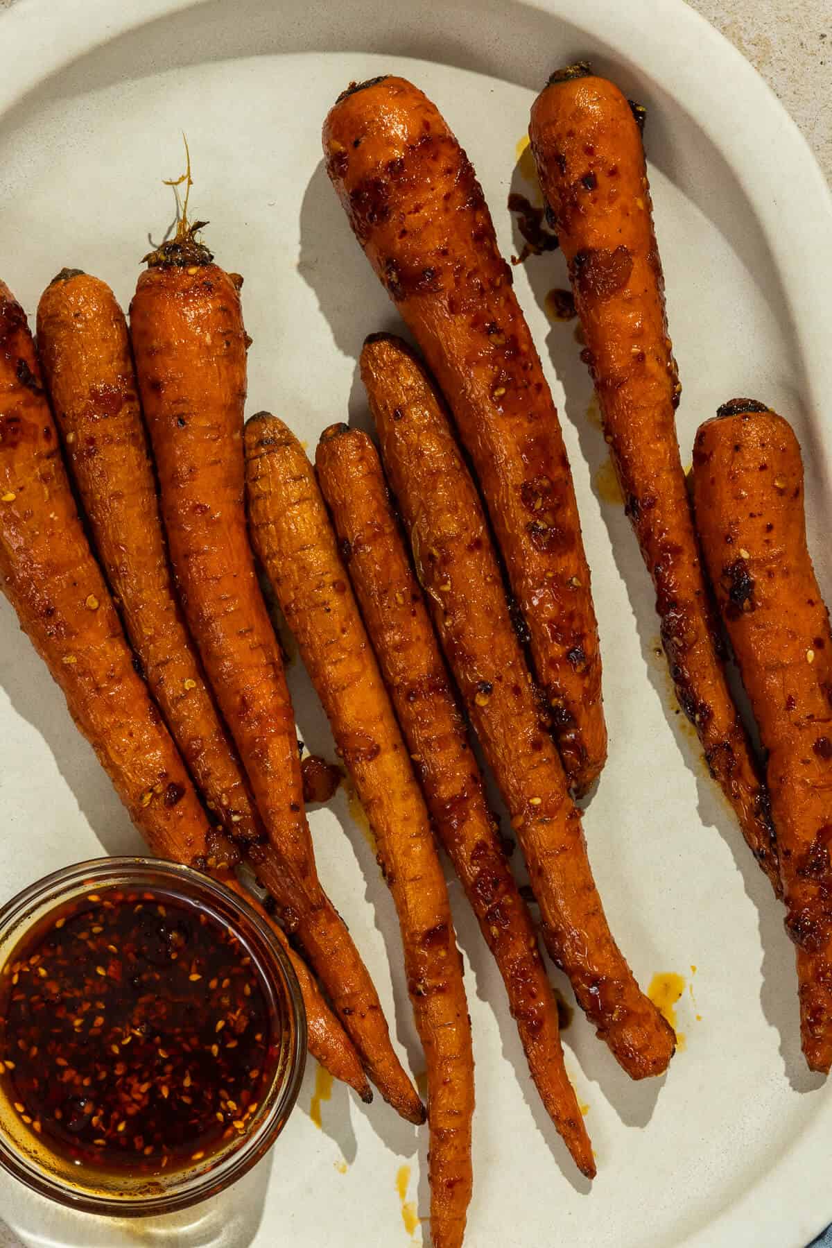 Apricot chili roasted carrots on a platter.
