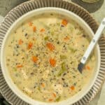 A bowl of creamy chicken and wild rice soup.