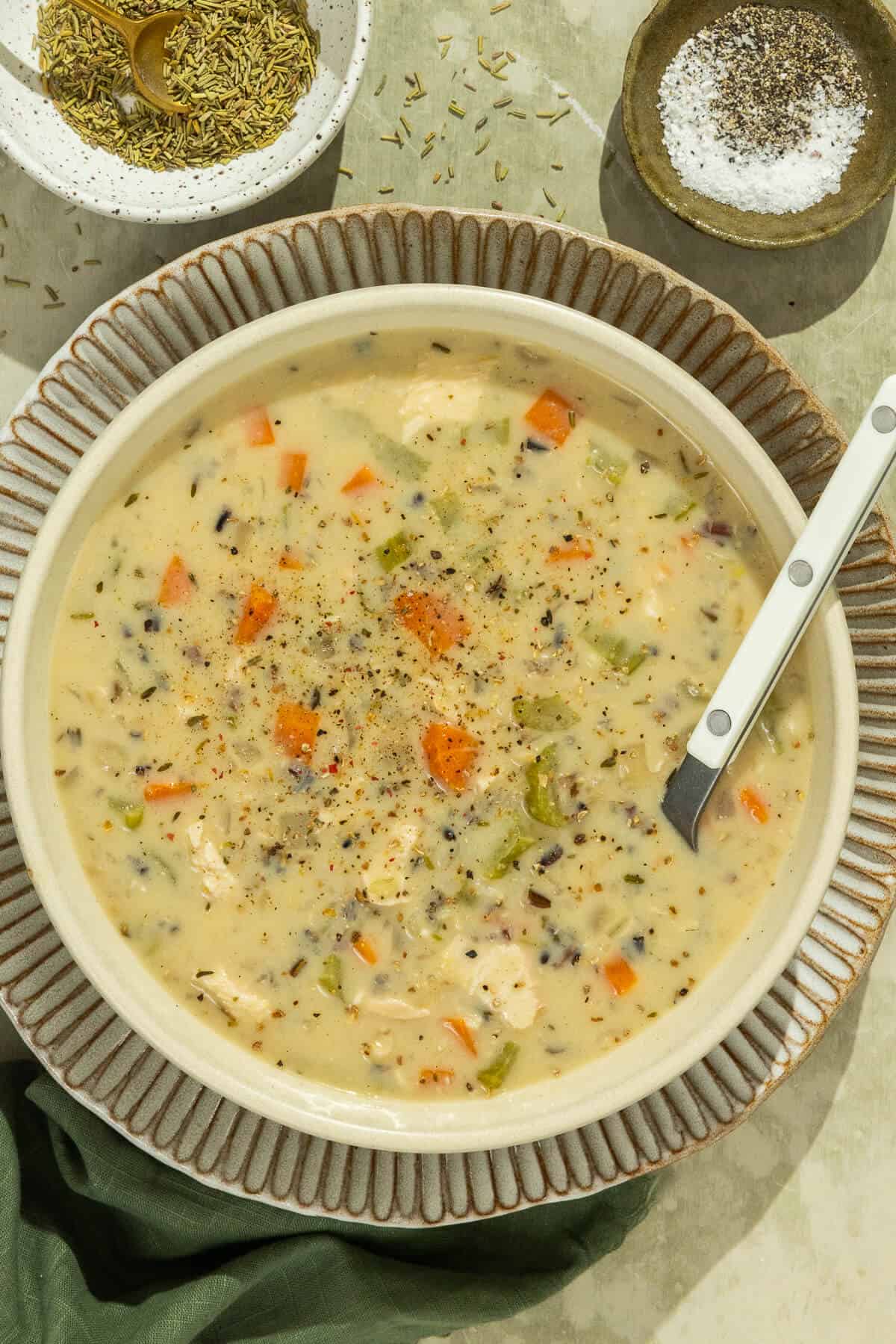 A bowl of creamy chicken and wild rice soup.