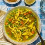 A bowl with chicken cous cous soup.