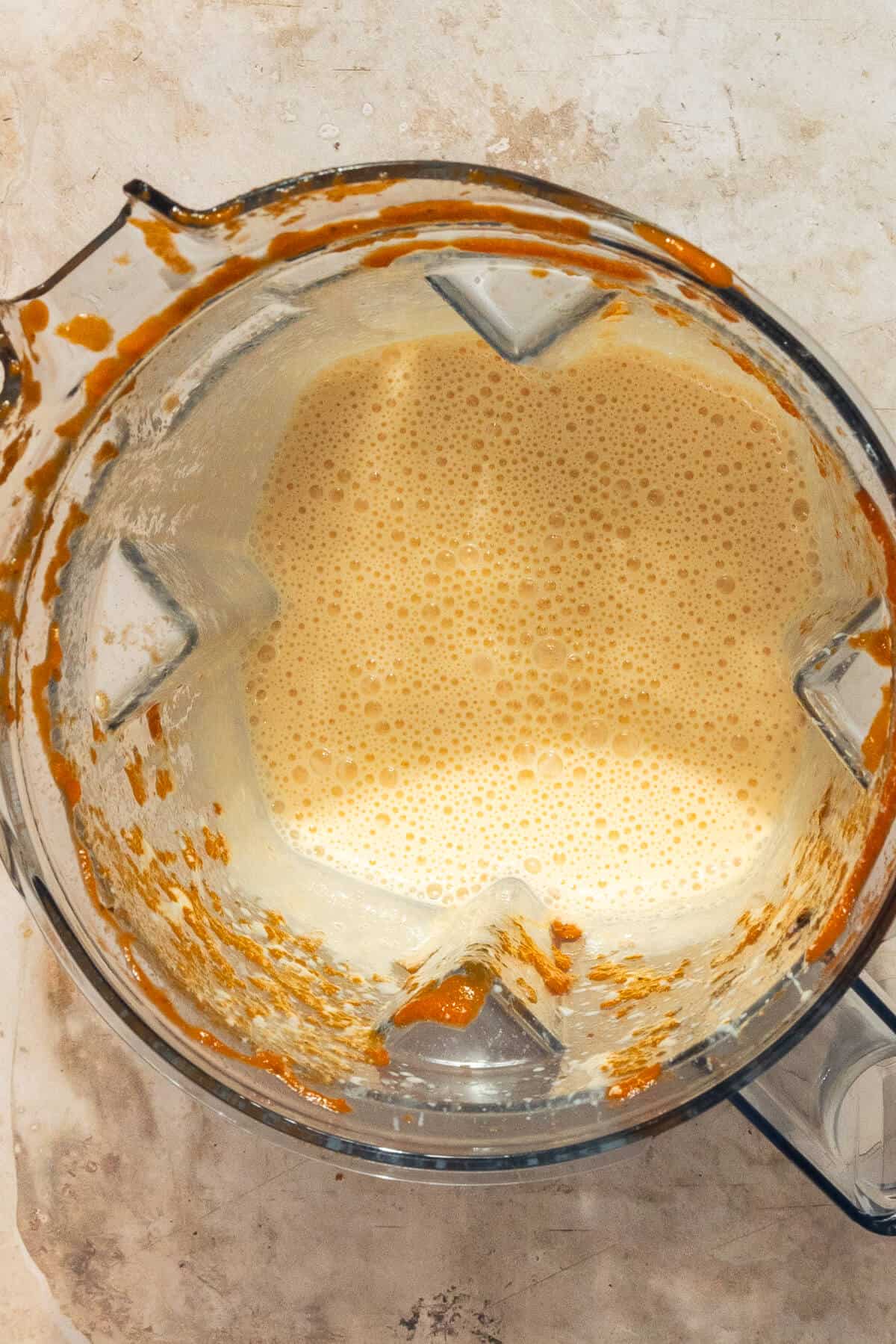 A blender with the blended cottage cheese.