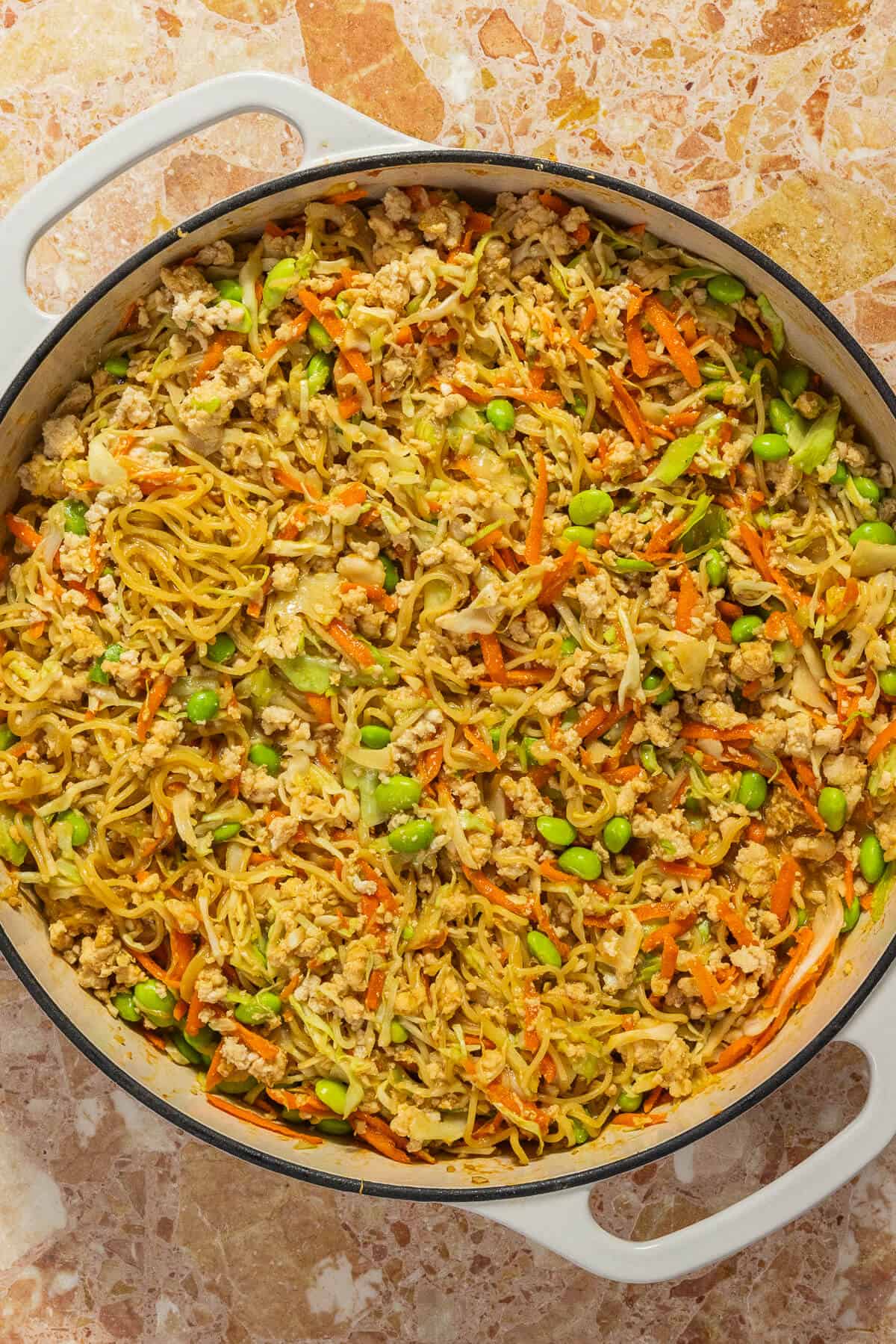 Large pan of peanut butter ramen noodles.