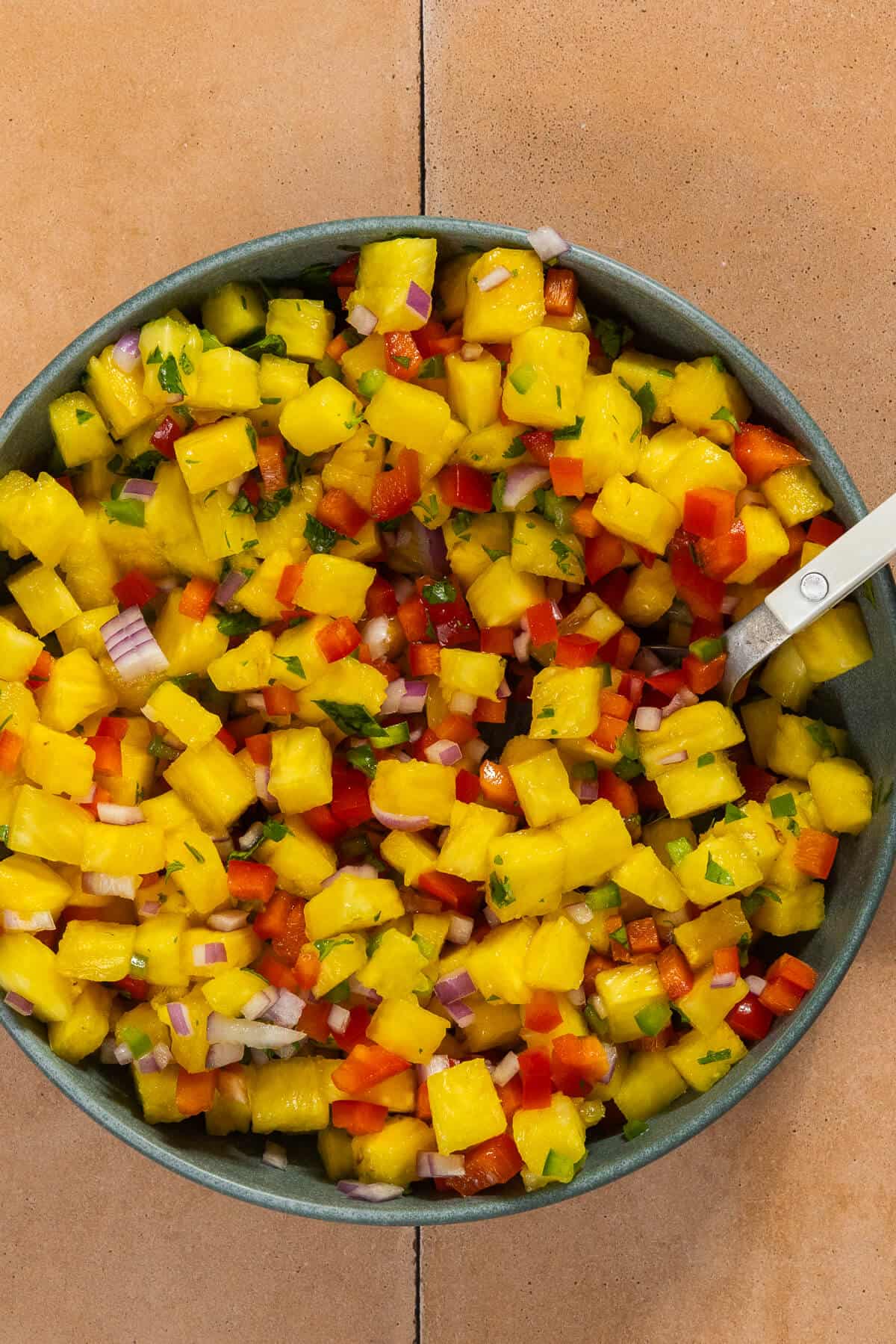 A bowl of pineapple salsa.