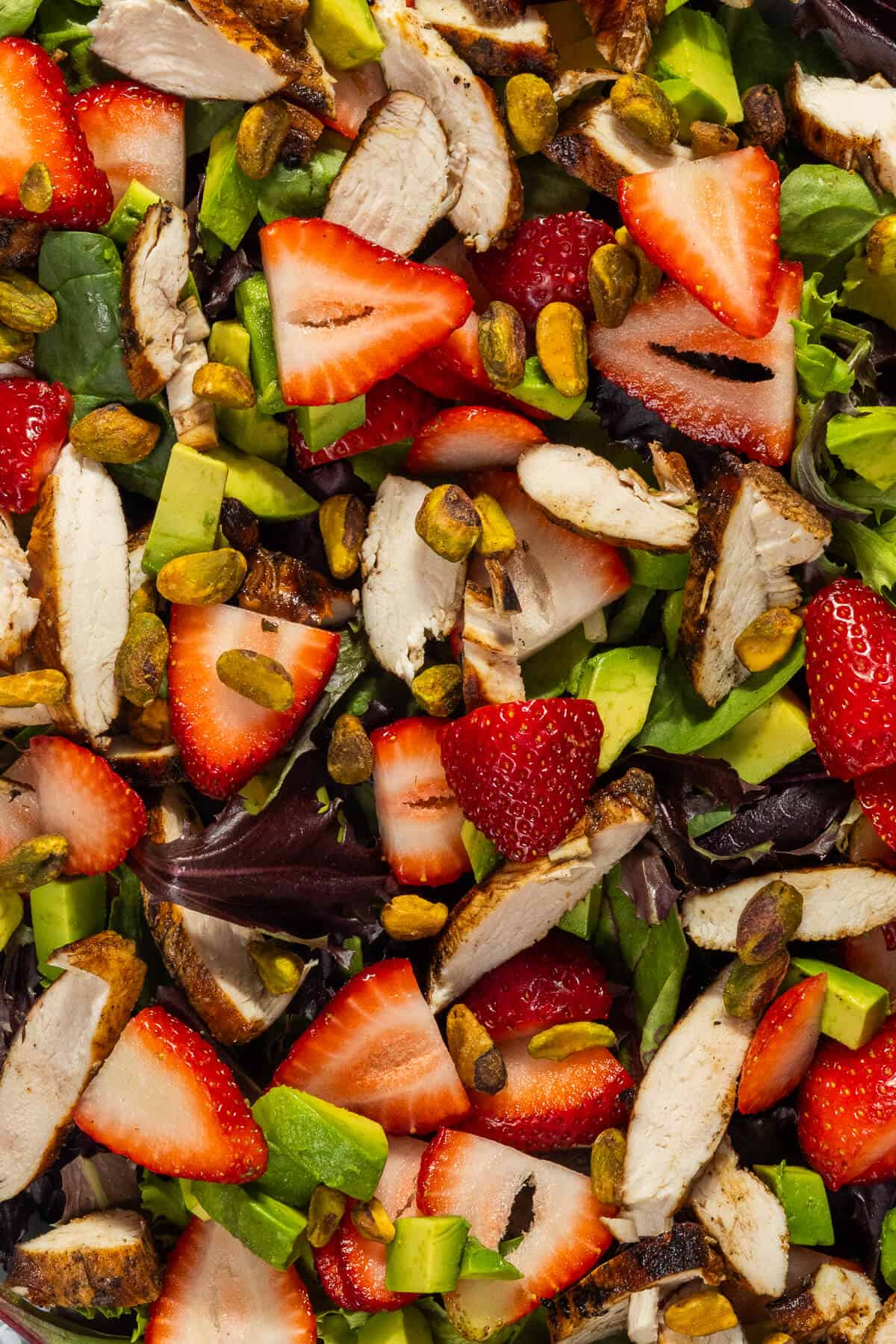 A close up image of the strawberry pistachio salad.