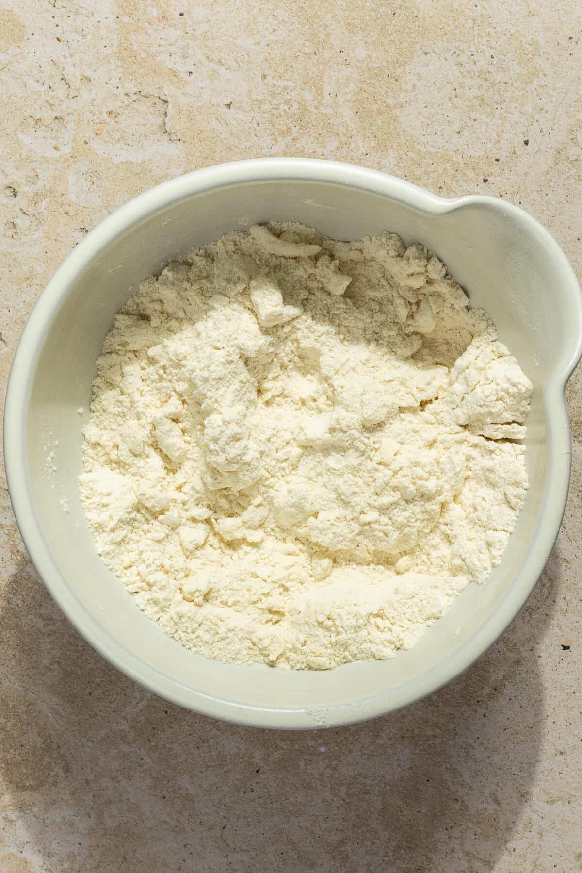A mixing bowl with the dry ingredients for the shortcakes.
