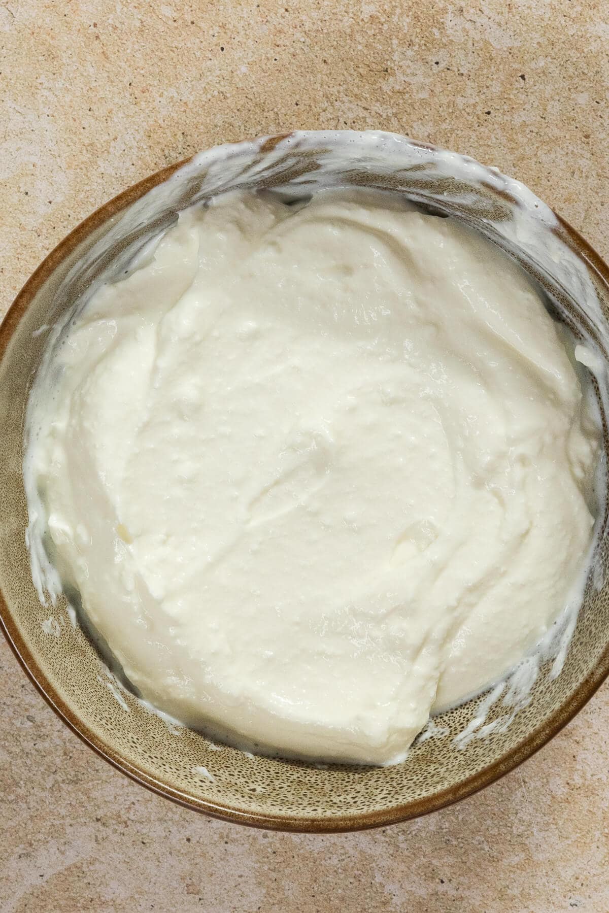 A bowl of blended cottage cheese for the street corn mixture.