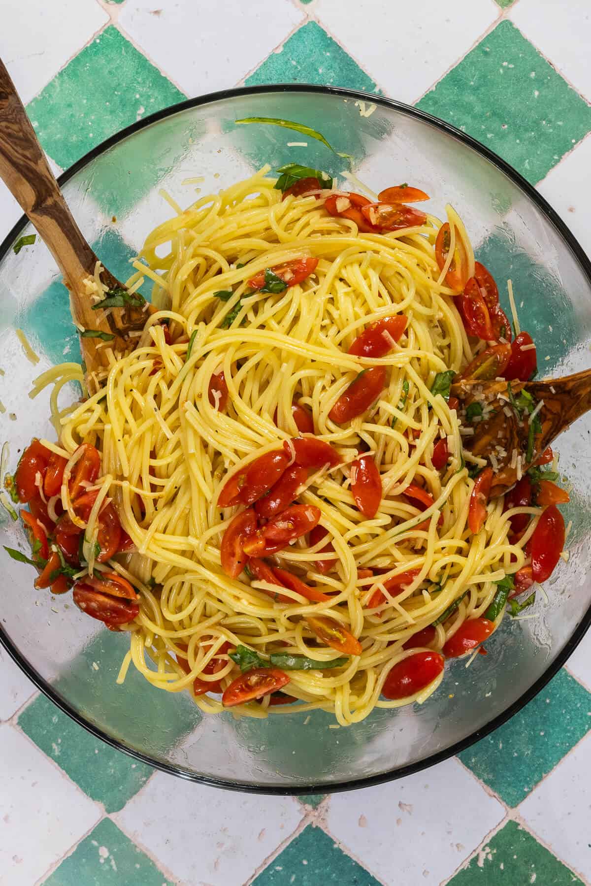 A large mixing bowl with the combined bruschetta pasta.