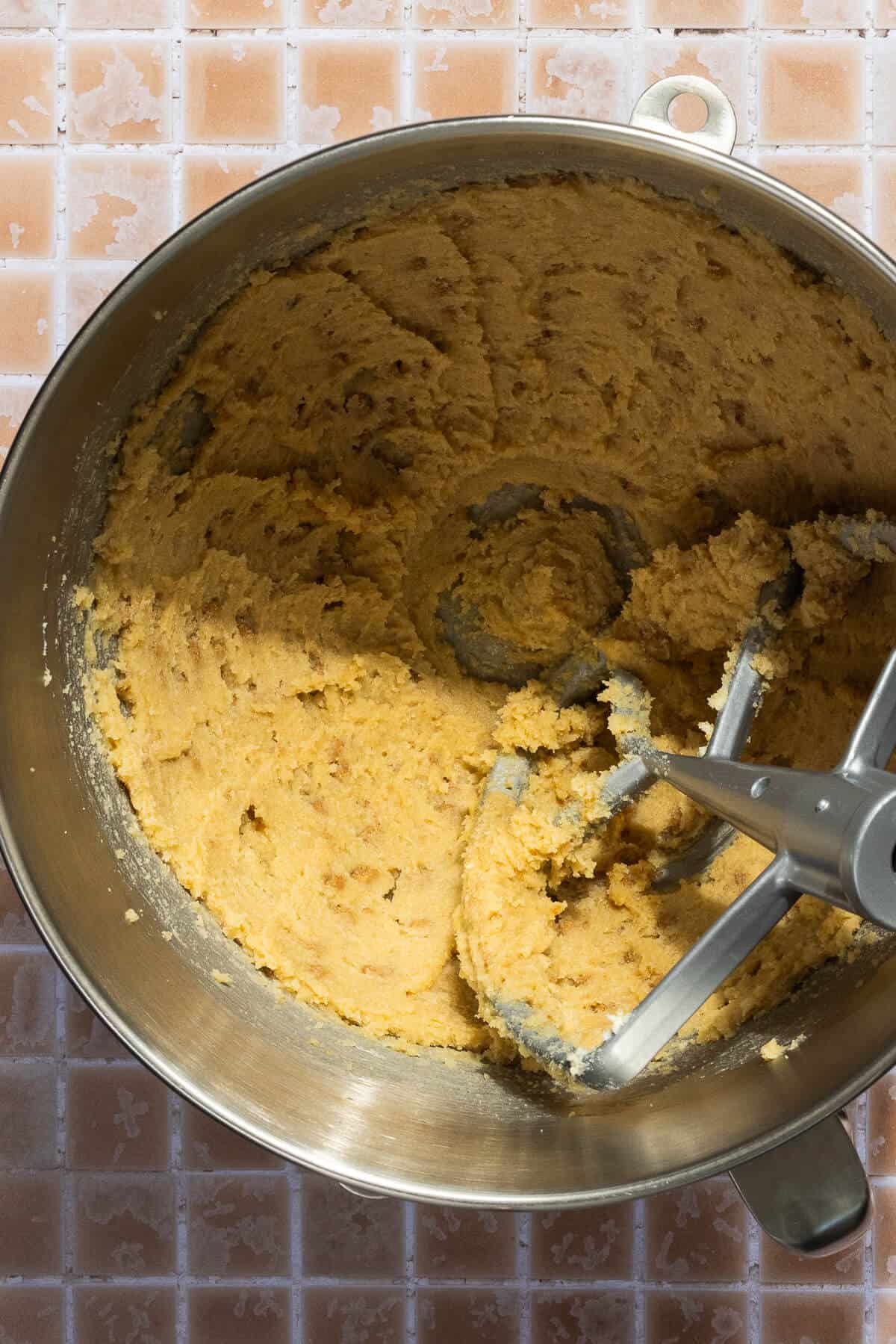 A mixing bowl of creamed butter and sugar.