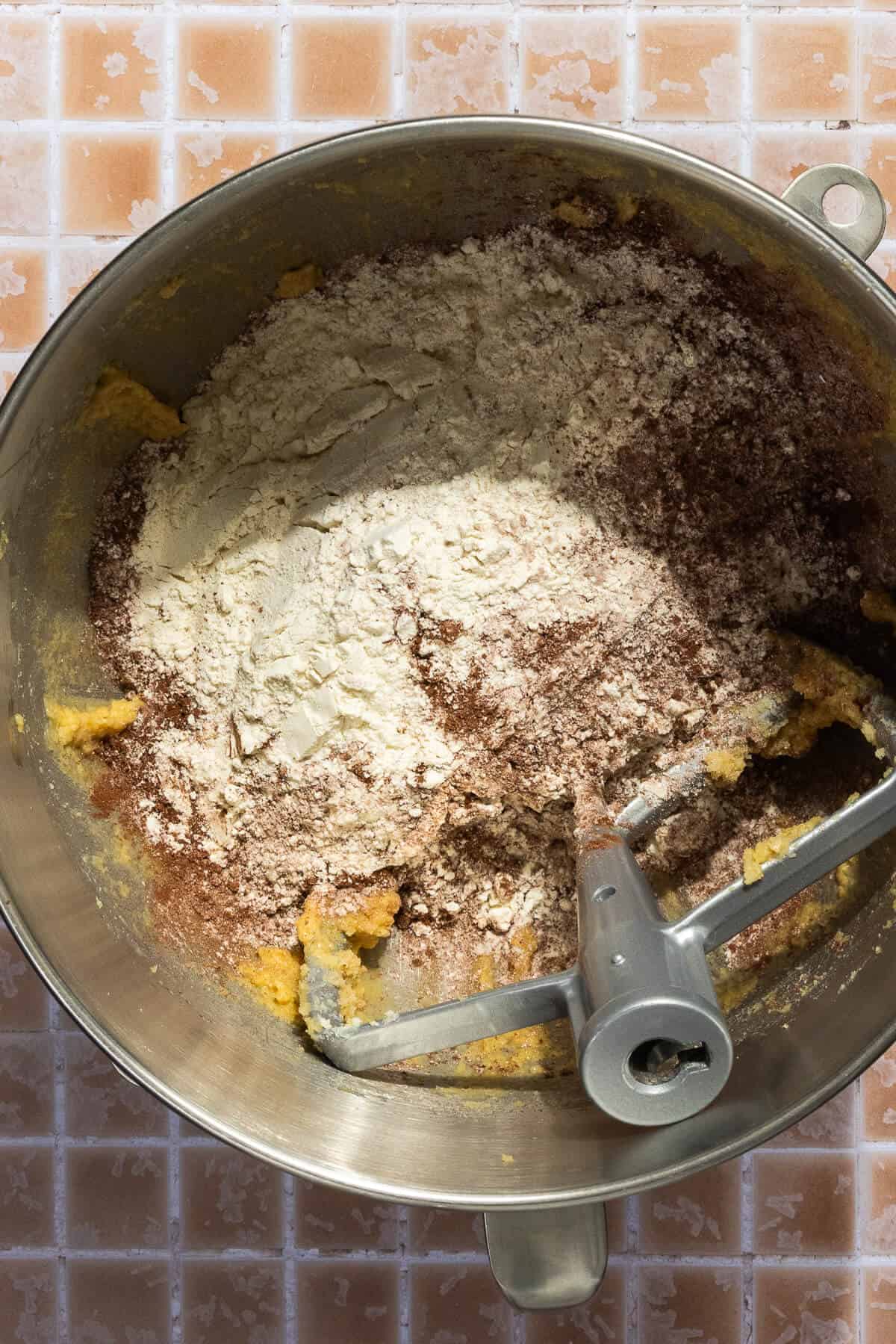 A mixing bowl with the cookie dough dry ingredients added to the combined wet ingredients.