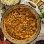 A large pot of prepared dutch oven chicken thighs.
