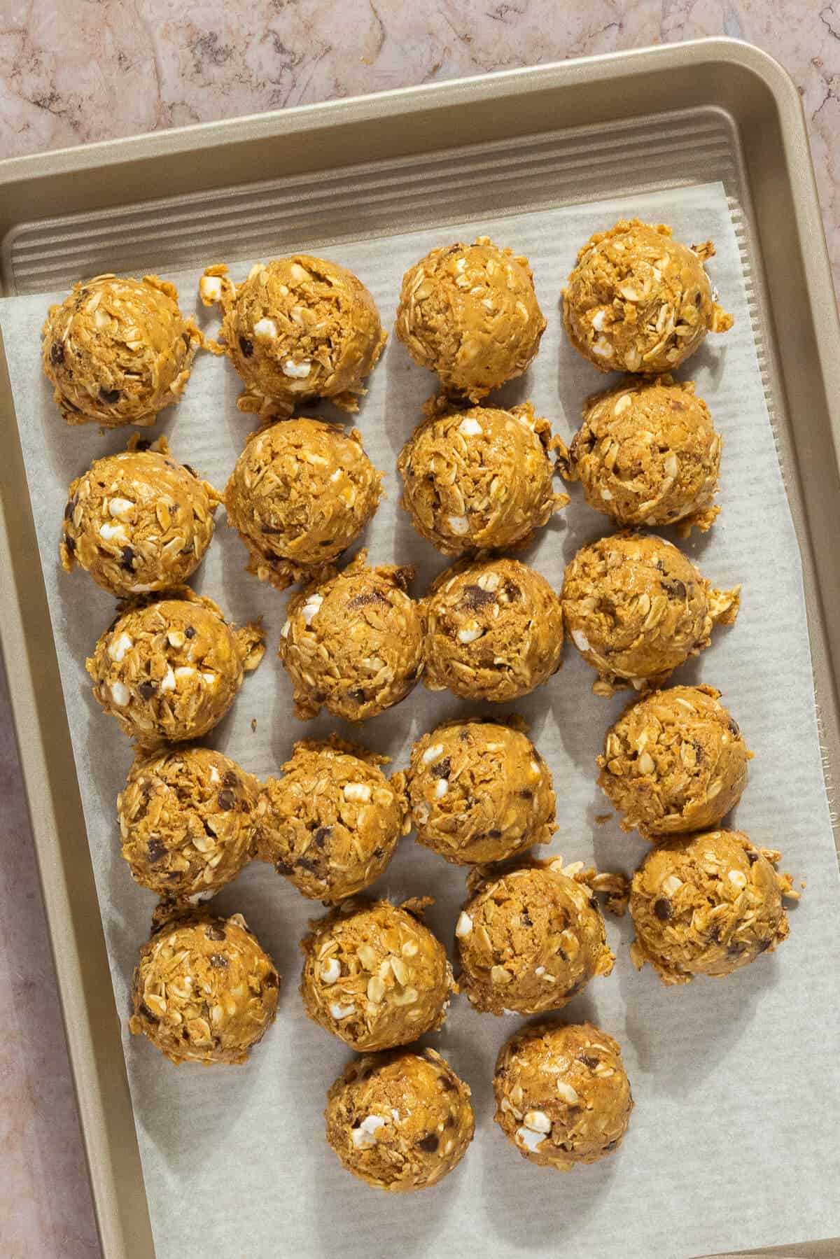 A cookie sheet with s'mores protein bites.