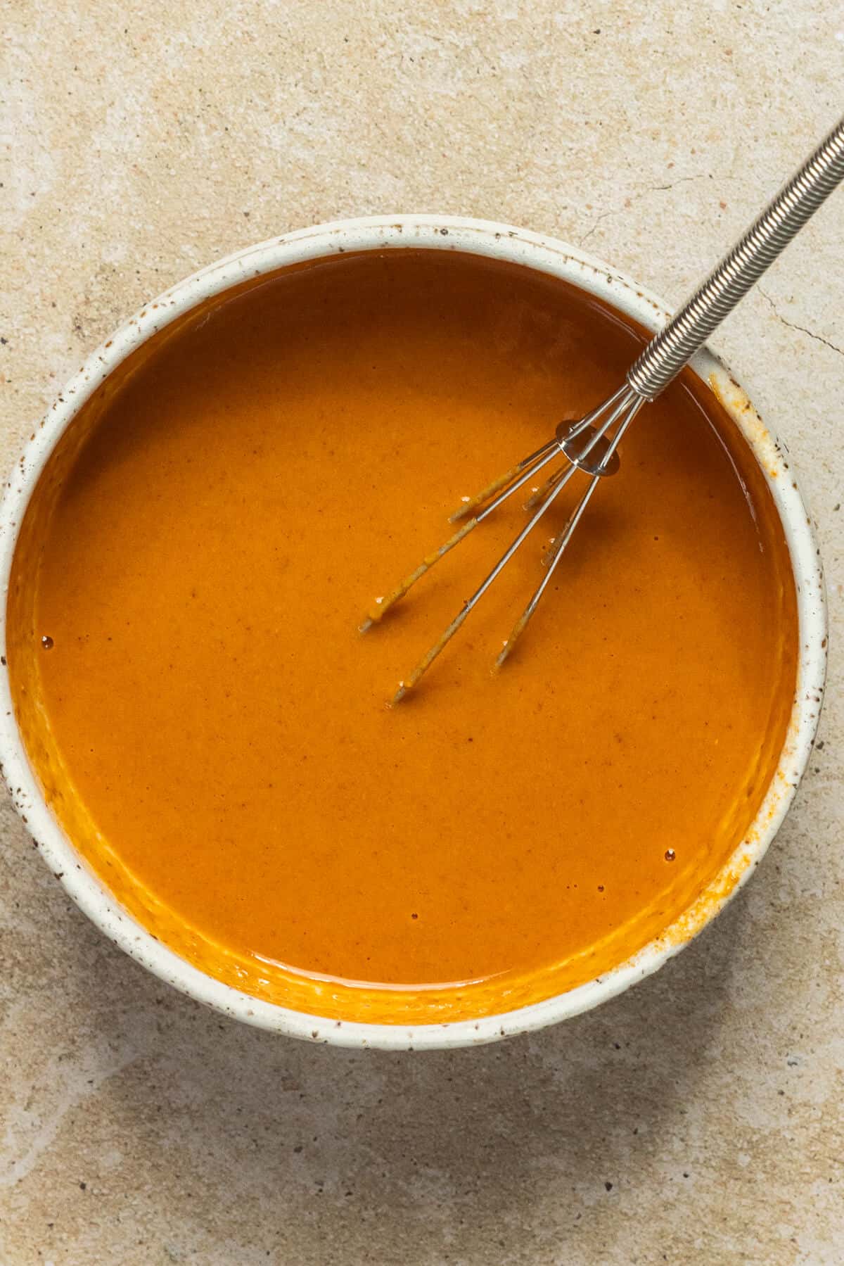 A bowl with the prepared satay sauce.
