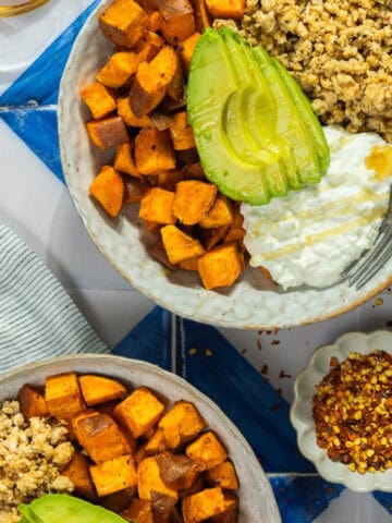 Sweet potato bowl with avocado, quinoa, and yogurt for healthy eating.